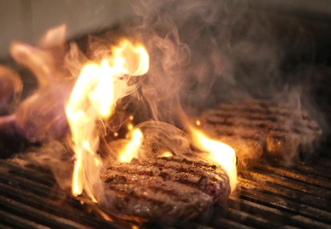 Charcoal Burger Being Grilled